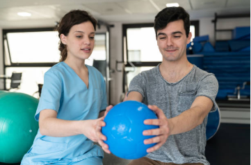 Physical Therapy Technician helping patient with mobility exercises and rehabilitation therapy